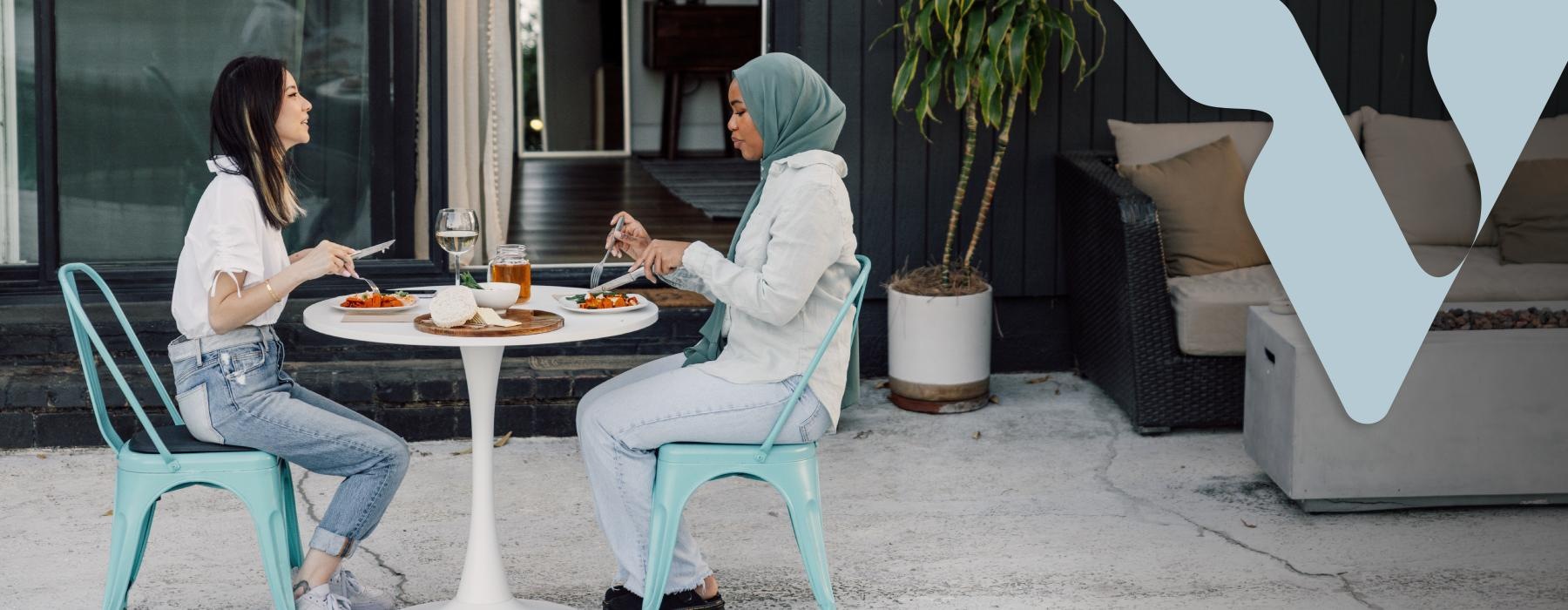 two women eating together