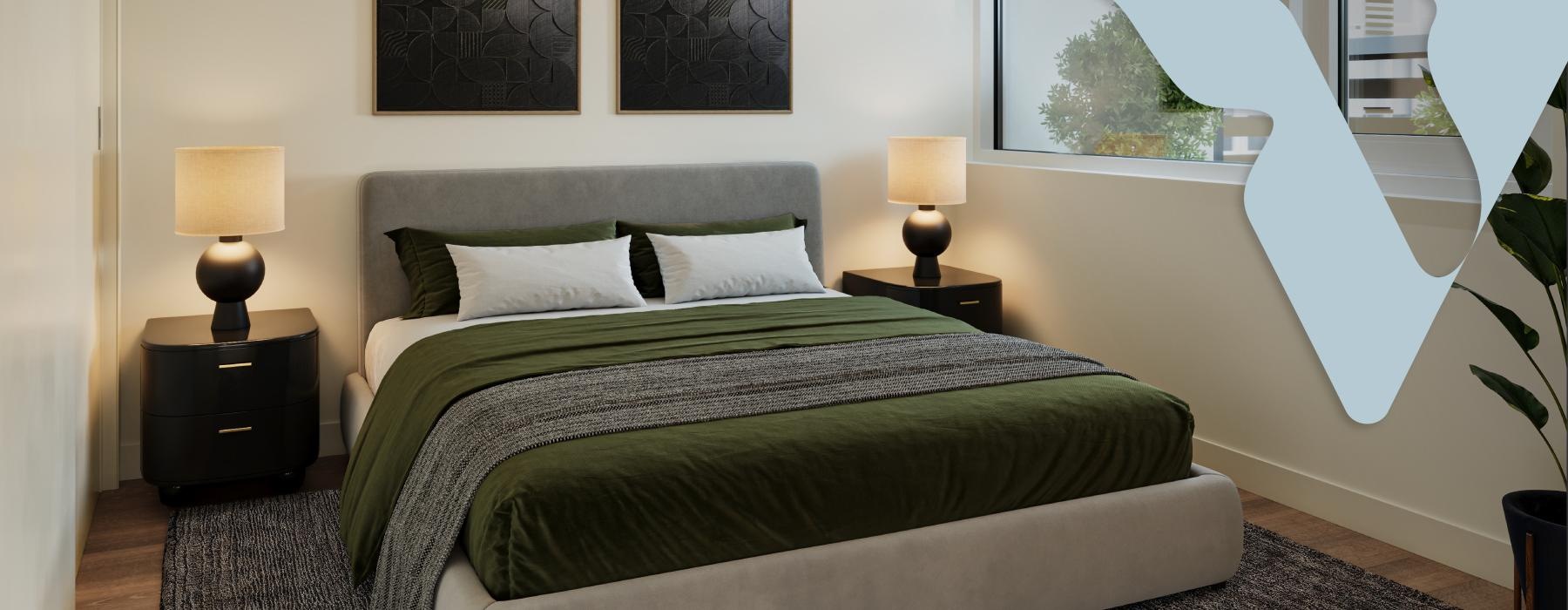 a bed with a green comforter